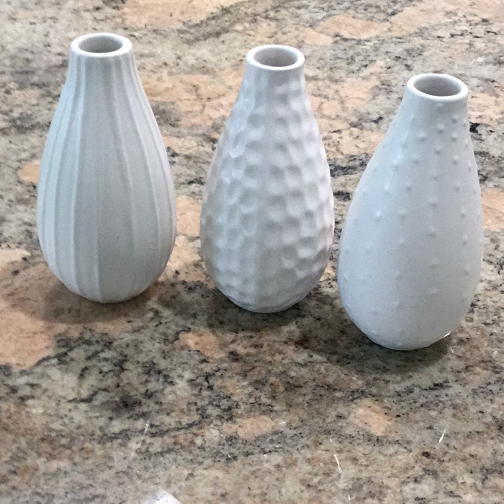 3 pottery bud vases in 3 different patterns.